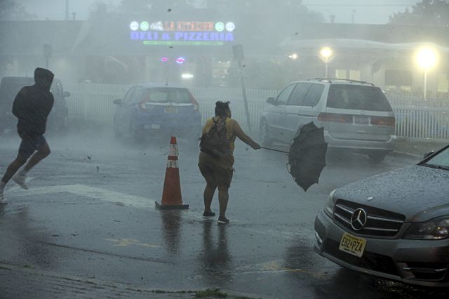 High winds and heavy rain were too much for this woman's umbrella in Brentwood, New York, as a sudden thunderstorm passed over Long Island on July 21st, 2022.